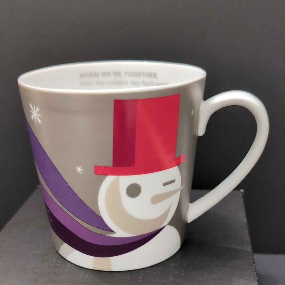 Starbucks 2011 Winking Snowman Coffee Mug with Red/ Purple Accents.